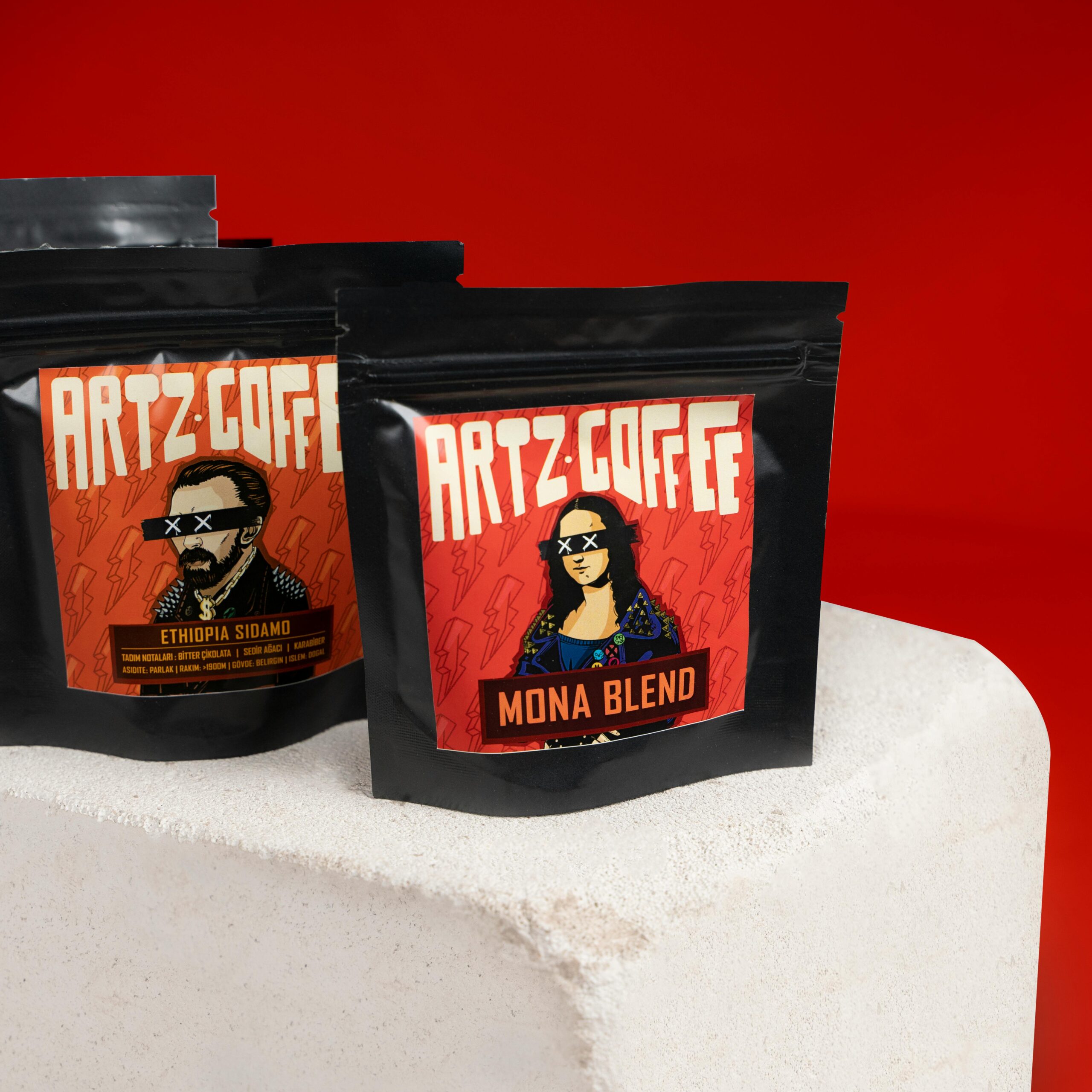 Artz Coffee brand showcased with graphic design packaging against a vibrant red backdrop.